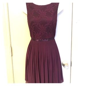 Pleated plum-purple dress with bead detail